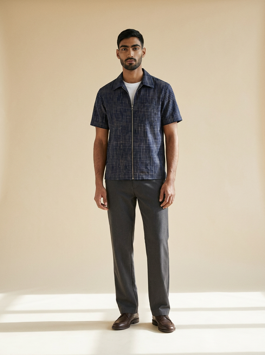 Model wearing The Plaid Zip Shirt. Generated image; the manufacturer's own photograph of this garment appears below.
