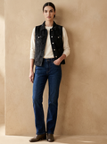 Model wearing The Washed Denim Vest. Generated image; the manufacturer's own photograph of this garment appears below.